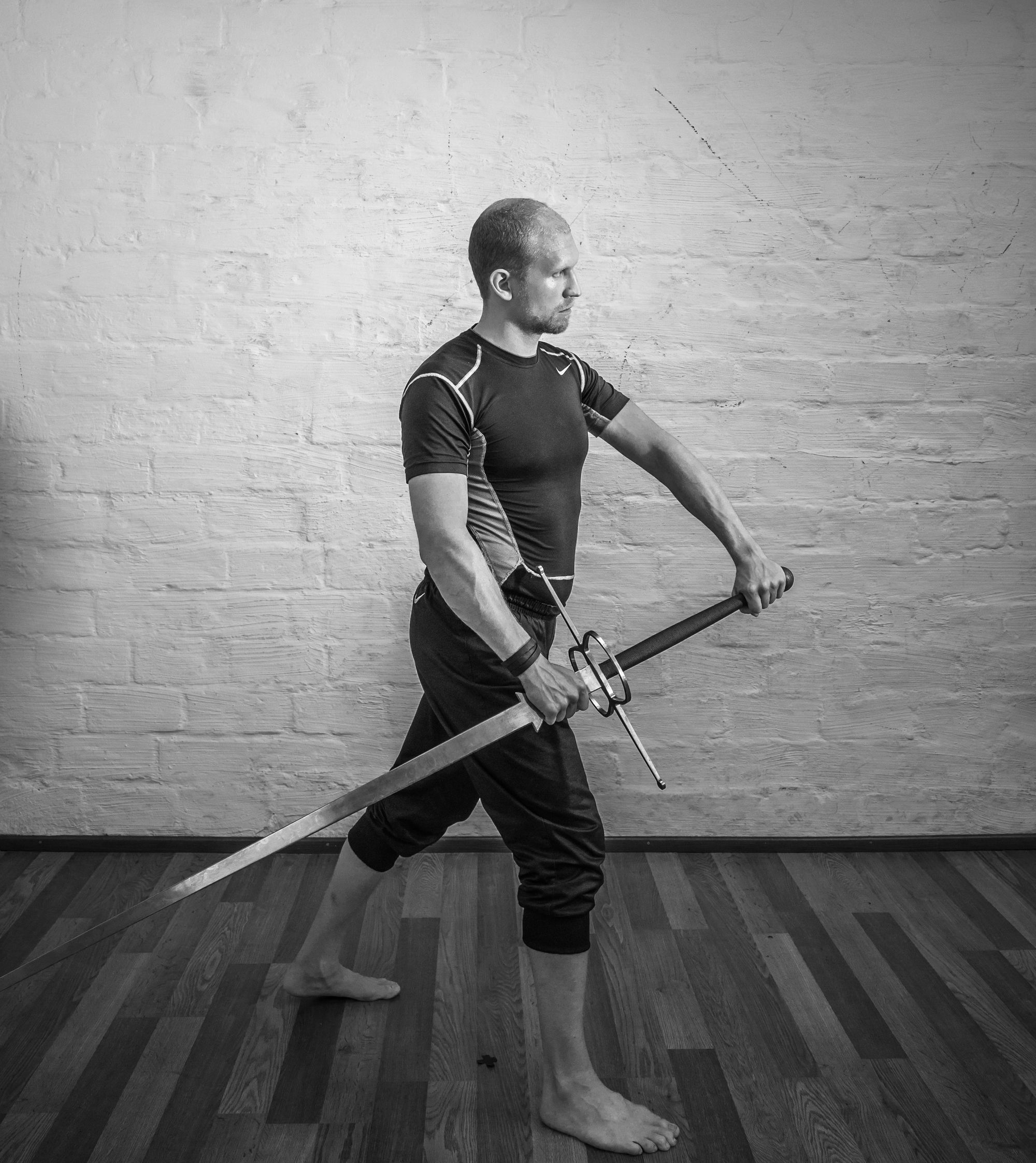 Bellicose Man On Grey Background Standing In Fighting Pose With Katana Sword  Stock Photo, Picture and Royalty Free Image. Image 22578800.